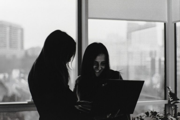 Women working in technology collaborating on AI innovation and digital projects.